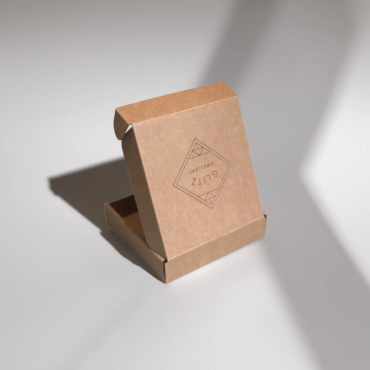 Comparison of paperboard substrates and rigid greyboard calipers for perfume boxes